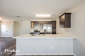 San Antonio house for rent - a kitchen with a white counter top and a stainless steel refrigerator