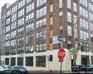 Philadelphia apartment for rent - a stop sign in front of a large building