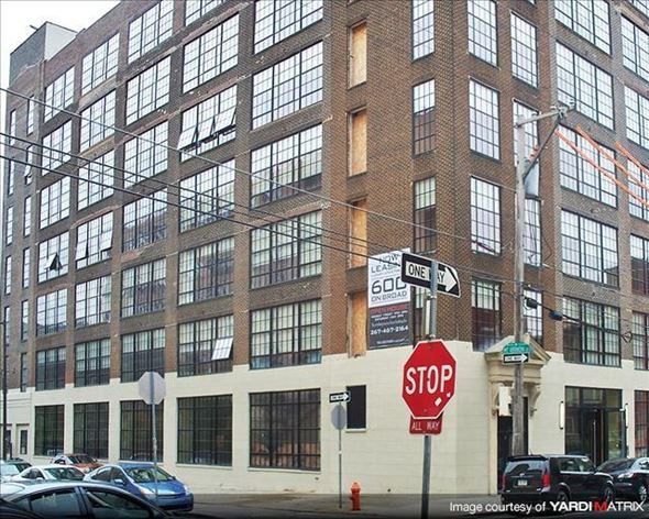 Philadelphia apartment for rent - a stop sign in front of a large building