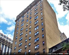 Philadelphia apartment for rent - a tall brown building with many windows on it