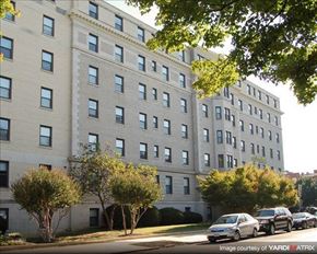 Richmond apartment for rent - a large apartment building with cars parked in front of it