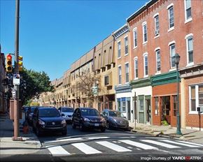 Philadelphia apartment for rent - a busy city street with cars parked at a traffic light