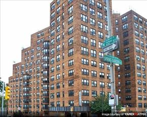 Philadelphia apartment for rent - a tall building with a street sign in front of it