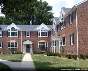 Baltimore apartment for rent - a large brick house with a sidewalk in front of it