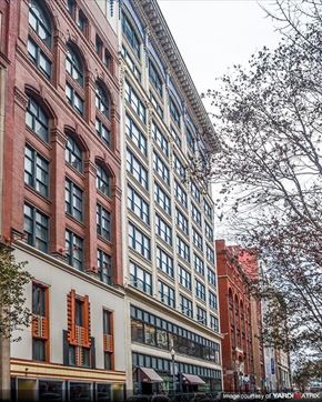 Pittsburgh apartment for rent - a tall building with a street in front of it