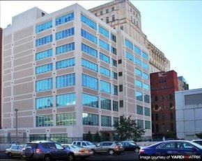 Philadelphia apartment for rent - a large building with cars parked in front of it