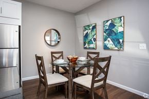 Millbury apartment for rent - a dining room with a table and chairs and paintings on the wall