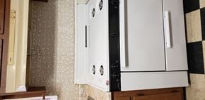 Pittsburgh apartment for rent - a white refrigerator freezer sitting next to a wall