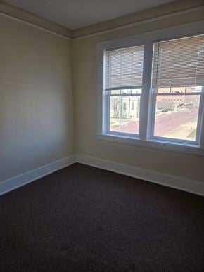 Canton apartment for rent - A room with a window and a view of a building outside.