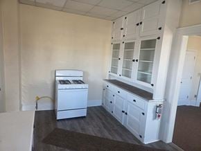 Canton apartment for rent - A white dishwasher and a white cabinet with glass doors are in a room.