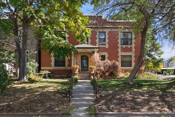 Denver apartment for rent - a brick house with a sidewalk in front of it