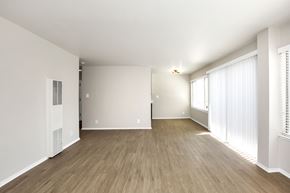 San Francisco apartment for rent - A large empty room with wooden flooring and white walls.