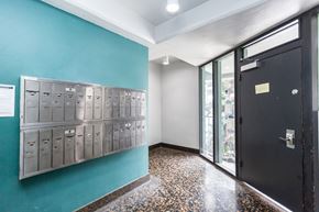 San Francisco apartment for rent - A hallway with a blue wall and a black door.