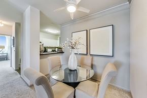 Aurora apartment for rent - a dining room with a glass table and chairs