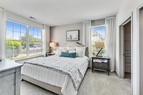 Aurora apartment for rent - a bedroom with a large bed and windows