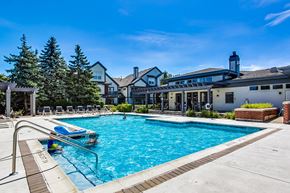 Aurora apartment for rent - a swimming pool with a building in the background