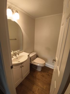 Belcarra apartment for rent - A white bathroom with a toilet and sink.