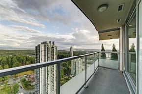 Coquitlam apartment for rent - a balcony with a view of a city and some tall buildings