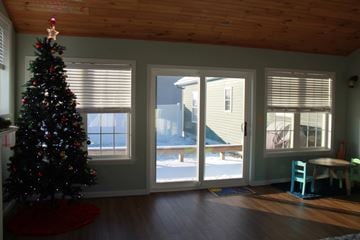 Watertown house for rent - a christmas tree in the corner of a living room