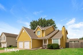 Belton house for rent - a yellow house with white garage doors and a blue sky