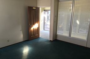 Castro Valley apartment for rent - the living room of a house with a door and windows