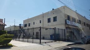 Compton apartment for rent - the front of a building with a fence and a gate