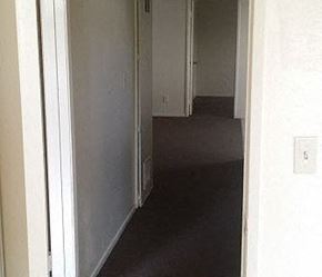Los Angeles apartment for rent - a hallway with an open door and a room with a door