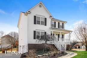 Clemmons house for rent - a white house with black shutters and a sidewalk