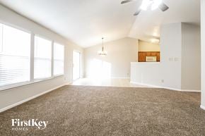 Avon house for rent - A spacious room with a carpeted floor and a ceiling fan.