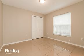 Wesley Chapel house for rent - a living room with a door and a window and a tiled floor