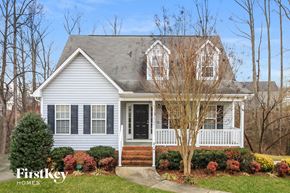 Winston Salem house for rent - a white house with black shutters and a front porch