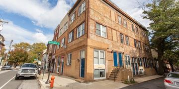 Philadelphia apartment for rent - a brick building on the corner of a city street
