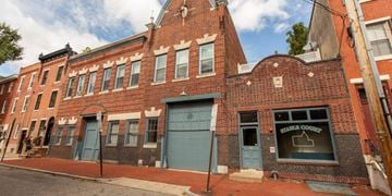 Philadelphia apartment for rent - the facade of a brick building with a blue door