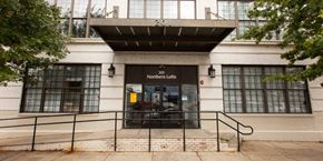 Philadelphia apartment for rent - the front of a building with a glass door and stairs