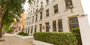 Philadelphia apartment for rent - a row of buildings on a city street