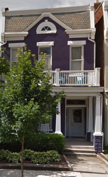 Richmond apartment for rent - a purple house with a balcony and a tree in front