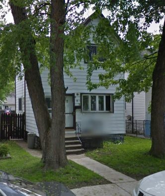 Windsor apartment for rent - A white house with a black fence and a tree in front.