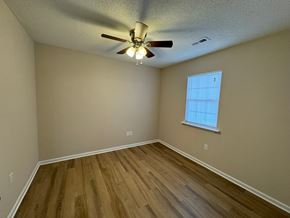 Rocky Mount apartment for rent - an empty bedroom with hardwood floors and a ceiling fan