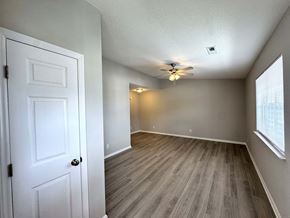 Rocky Mount apartment for rent - A room with a white door and a ceiling fan.