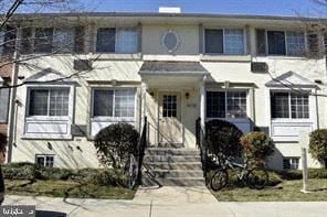 Laurel house for rent - A white two-story house with a front porch and a bicycle parked in front.