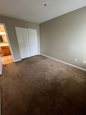 Laurel house for rent - A room with carpeted floor and a wall-mounted cabinet.