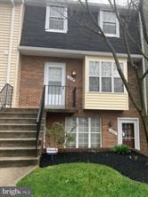 Laurel house for rent - A two-story house with a balcony on the second floor.