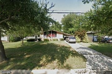 Temple Hills house for rent - A street view of a residential area with houses and cars.