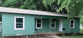 Killeen apartment for rent - a green house with a tree in front of it