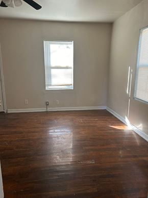 Killeen apartment for rent - an empty room with wooden floors and a window