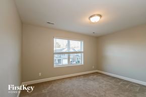 Charlotte house for rent - A room with a window showing a building outside.