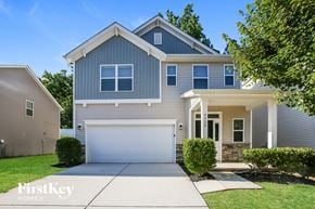 Charlotte house for rent - A modern house with a grey exterior and a white garage door.