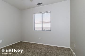 Buckeye house for rent - the living room of a home with a window and carpet