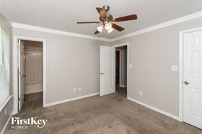 Douglasville house for rent - a bedroom with a ceiling fan and a door to a closet