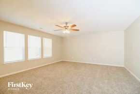 Winston Salem house for rent - a bedroom with carpet and a ceiling fan